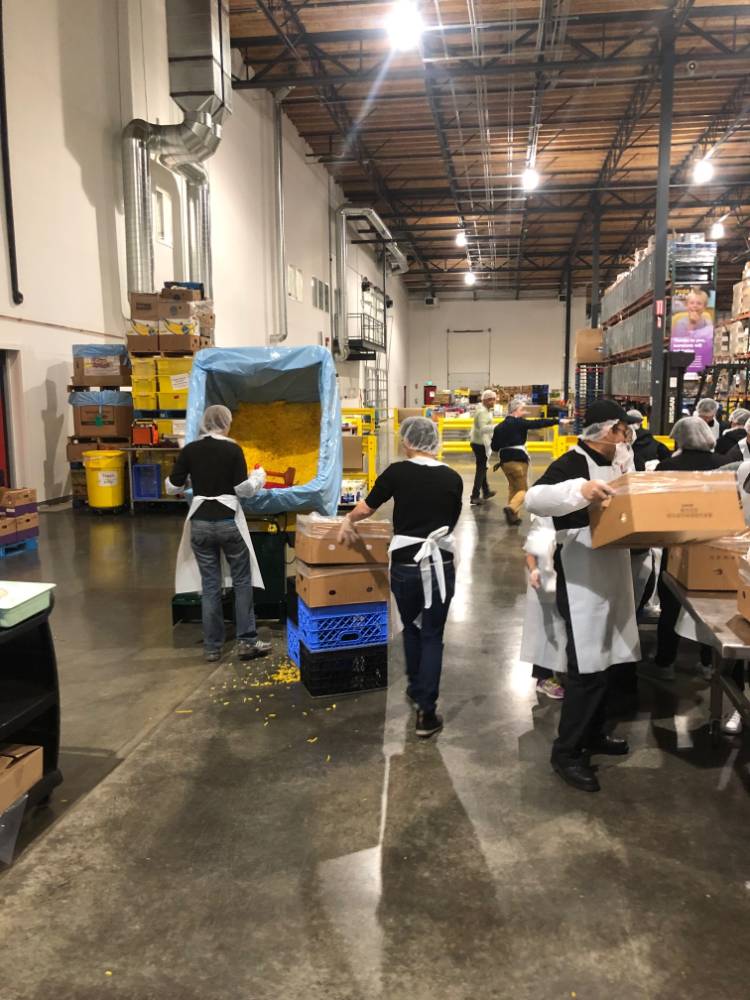 Volunteers sorting boxes at Food Lifeline in Seattle.